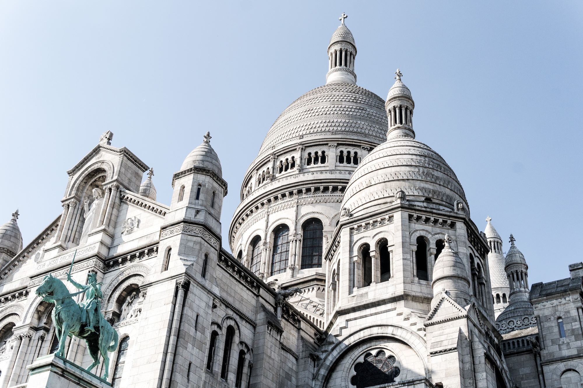 A beautiful low angle shot of the famous Sacre-Coeur cathedral in Paris, France